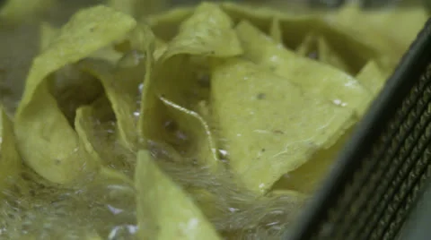 Frying corn chips 02 CU Stock Footage 25540777