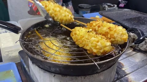Frying Corndogs at a Night Market Stock Footage 288057801