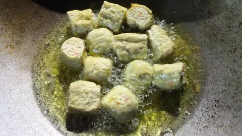 Frying crab meat roll in pan, in door  Chiangmai  Thailand. Stock Footage 296718039