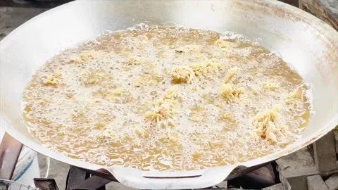Frying crispy fried chicken in boiling hot oil in a large pan Video stock 333637976