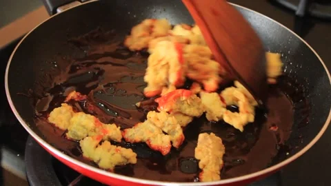 Frying crispy meat with spicy sauce Stock Footage 334647359