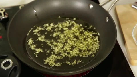 Frying cut garlic Stock Footage 49782993