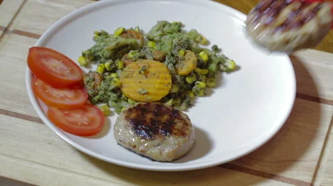 Frying cutlets in white plate Stock Footage 59761738
