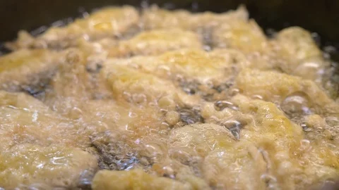 Frying delicious  artichokes in batter - macro Stock-Footage 90492308