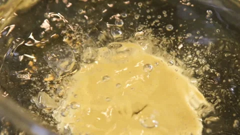Frying donut, preparing donut at home, slow motion Stock Footage 204999752