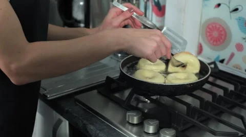 Frying donuts in a kitchen, detail of a kitchen, sweet dessert Stock Footage 68908888