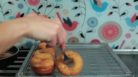 Frying donuts in a kitchen, detail of a kitchen, sweet dessert Stock Footage 68908944