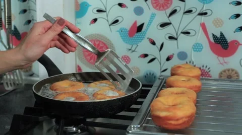 Frying donuts in a kitchen, detail of a kitchen, sweet dessert Stock Footage 68908947