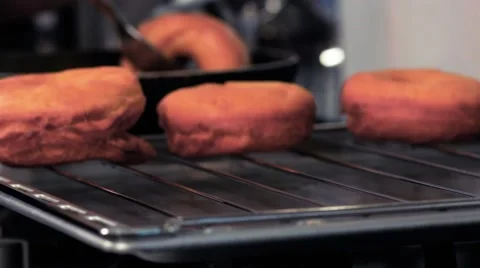 Frying donuts in a kitchen, detail of a kitchen, sweet dessert Stock Footage 68909000