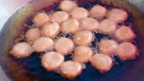 Frying the dough for making Thai desserts Stock Footage 130546347