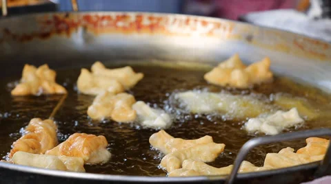 Frying dough stick in a hot pan Video stock 38116019