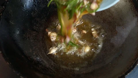 Frying egg with acacia in pan Stock Footage 97174235