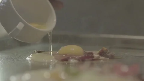 Frying egg and bacon Stock Footage 72319458