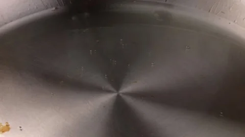 Frying an egg in a frying pan Stock Footage 8573293