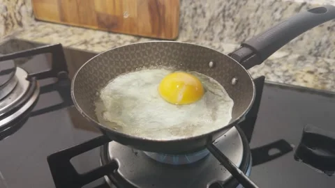 Frying egg Home cooking Stock Footage 341963035