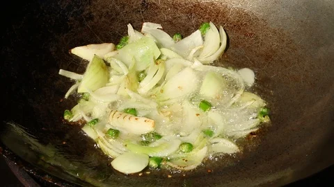 Frying egg with onion in pan Stock Footage 99282615