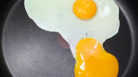 Frying Egg On The Pan Stock Footage 37136345