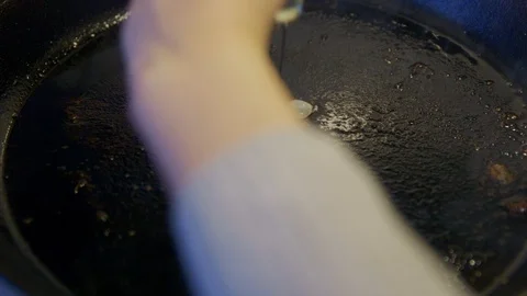 Frying a egg in the pan Stock Footage 92203548