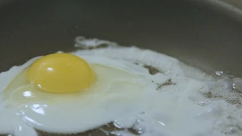 Frying an Egg on the Stovetop Stock Footage 91225632