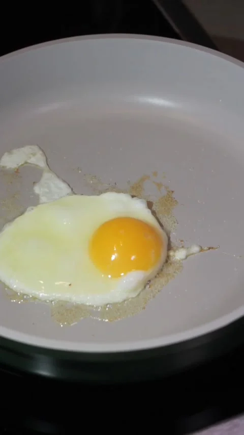Frying Egg Sunny Side Up On Pan Stock Footage 328916407