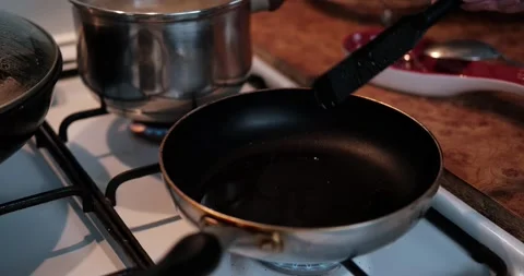 Frying eggplants and tomatoes in a pan. Stock Footage 137385977