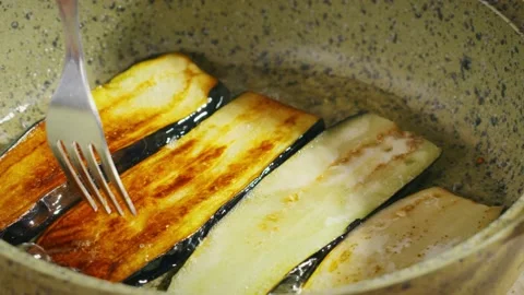 Frying eggplants on pan Stock Footage 138127471
