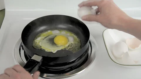 Frying eggs Stock Footage 45579066