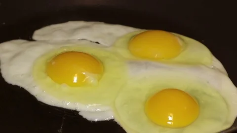 Frying eggs Stock Footage 107435338