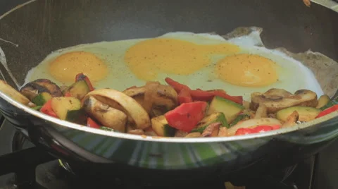 Frying Eggs In Frying Pan Adding Salt Video stock 65760289