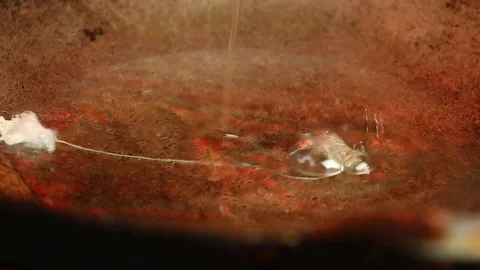 Frying   eggs  in pan close up Stock Footage 106928636