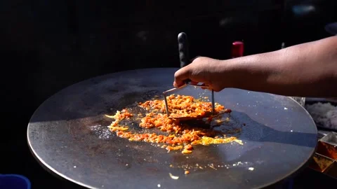 Frying eggs vegetable mix in hot oil close-up 動画素材 133270232