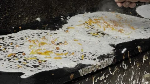 Frying a Feast  Expert Hand in Action Stock Footage 327589662