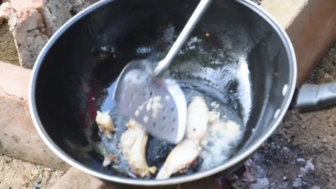 Frying fish with charcoal fire Stock Footage 128471625