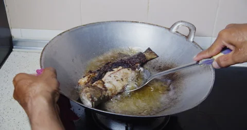 Frying fish Stock Footage 141185195