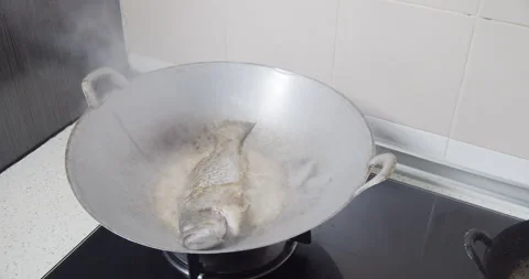 Frying fish Stock Footage 141265364