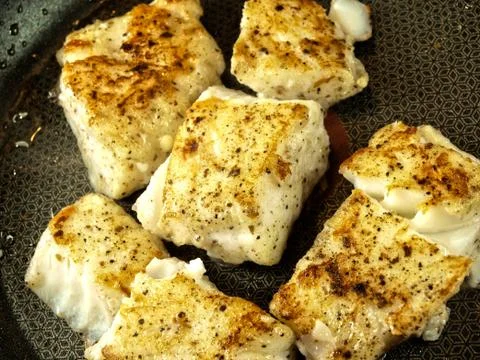 Frying fish, frying pan Stock Photos