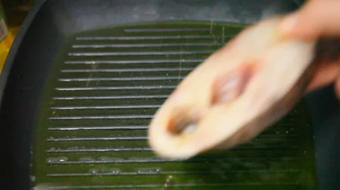 Frying fish in a grill pan. Video macro Stock Footage 39579040