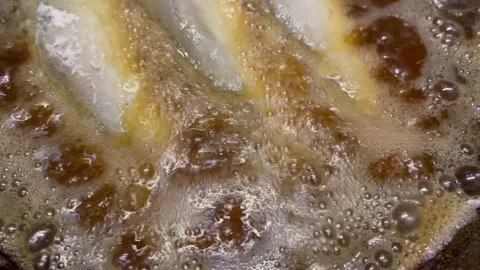 Frying Fish in Oil Stock Footage 345305378