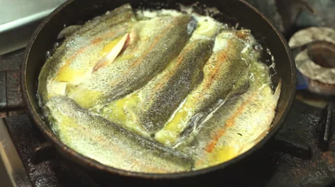 Frying fish in a pan Stock Footage 35741798