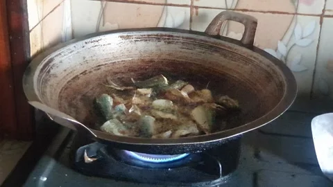 Frying fish in a pan Stock Footage 313855053