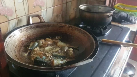 Frying fish in a pan Stock Footage 313855057
