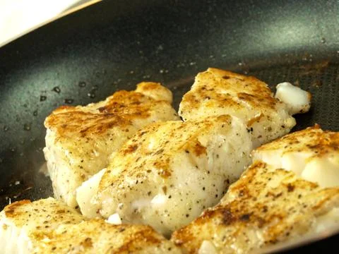 Frying fish Stock Photos