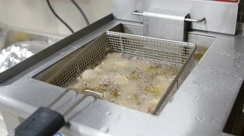 Frying fish in a professional kitchen Stock Footage 51417160