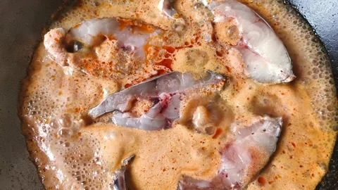 Frying fish with red curry paste Stock Footage 339537136