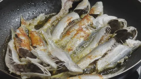 Frying Fish In Spicy Oil in Pan Stock Footage 335095203