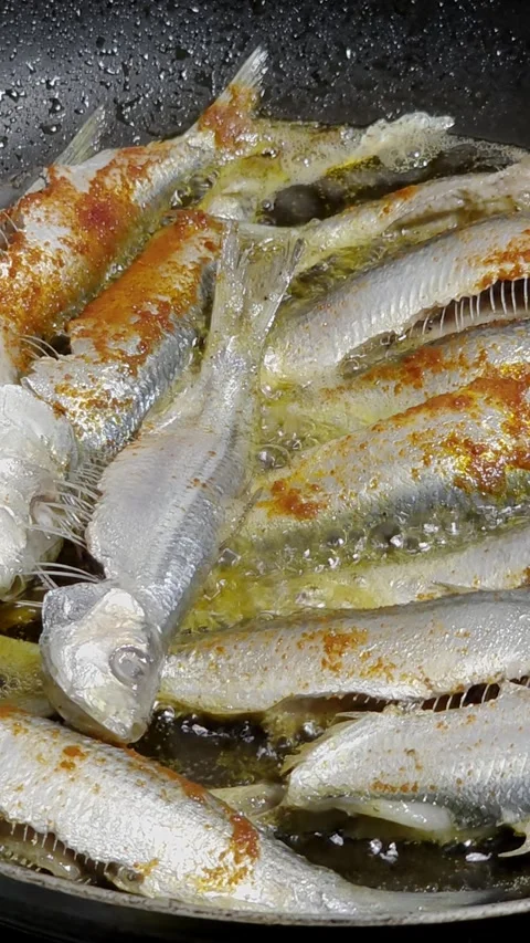Frying Fish In Spicy Oil in Pan Stock Footage 335095271