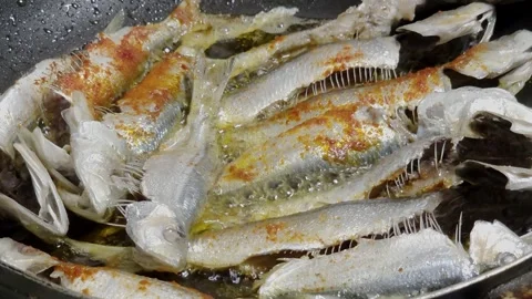 Frying Fish In Spicy Oil in Pan Stock Footage 335095868