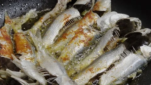 Frying Fish In Spicy Oil in Pan Stock Footage 335096084