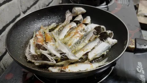 Frying Fish In Spicy Oil in Pan Stock Footage 335096239