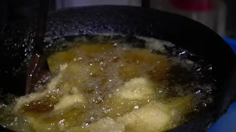 Frying Food in a Pan Stock Footage 319949251